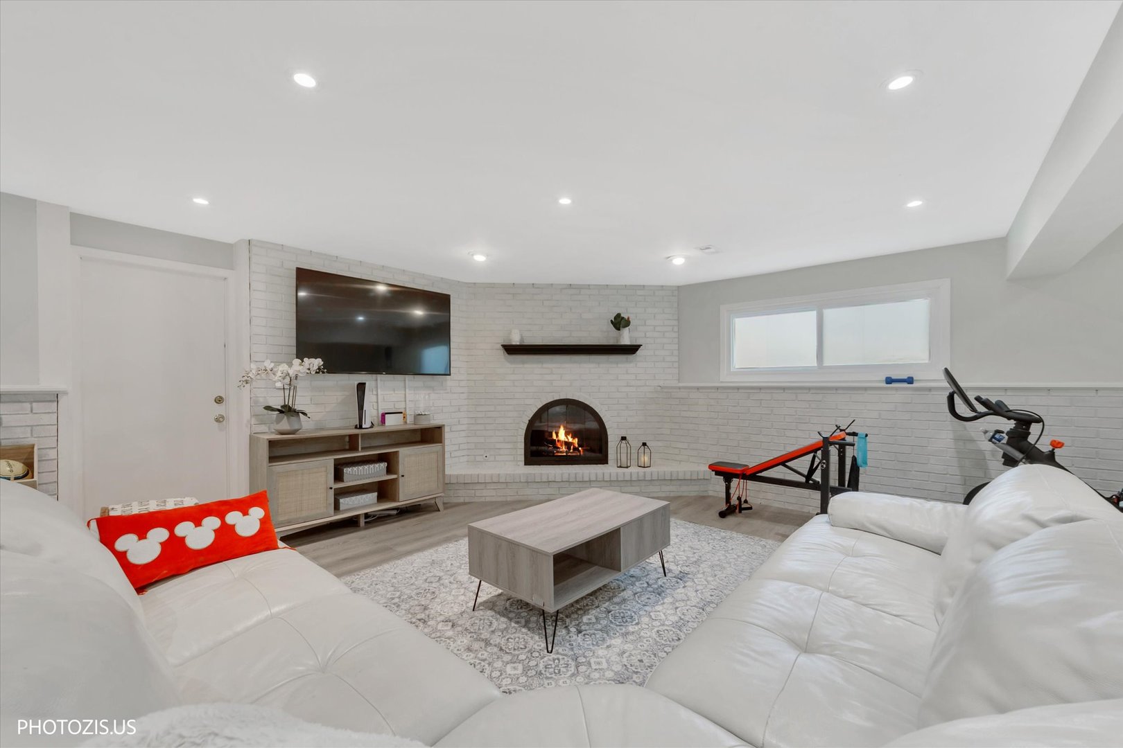 981 North Mill Road Addison, IL 60101 - Photo 27 of 41 a living room with furniture and a flat screen tv