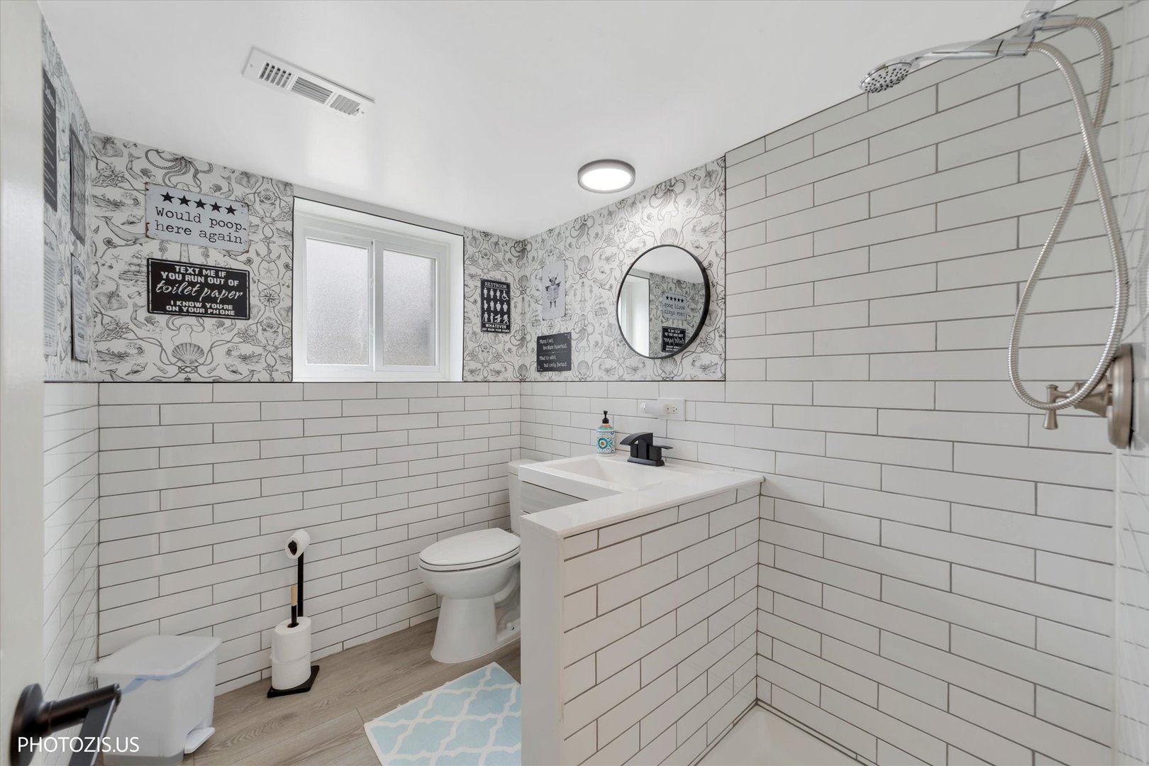 981 North Mill Road Addison, IL 60101 - Photo 29 of 41 a bathroom with a toilet sink and mirror