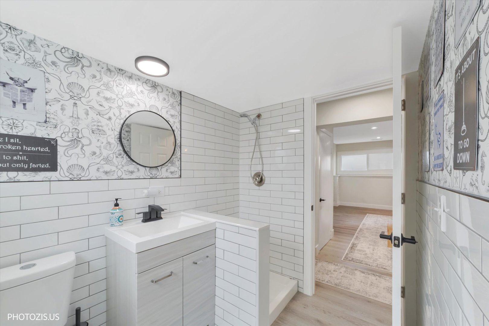 981 North Mill Road Addison, IL 60101 - Photo 30 of 41 a bathroom with a double vanity sink mirror and shower