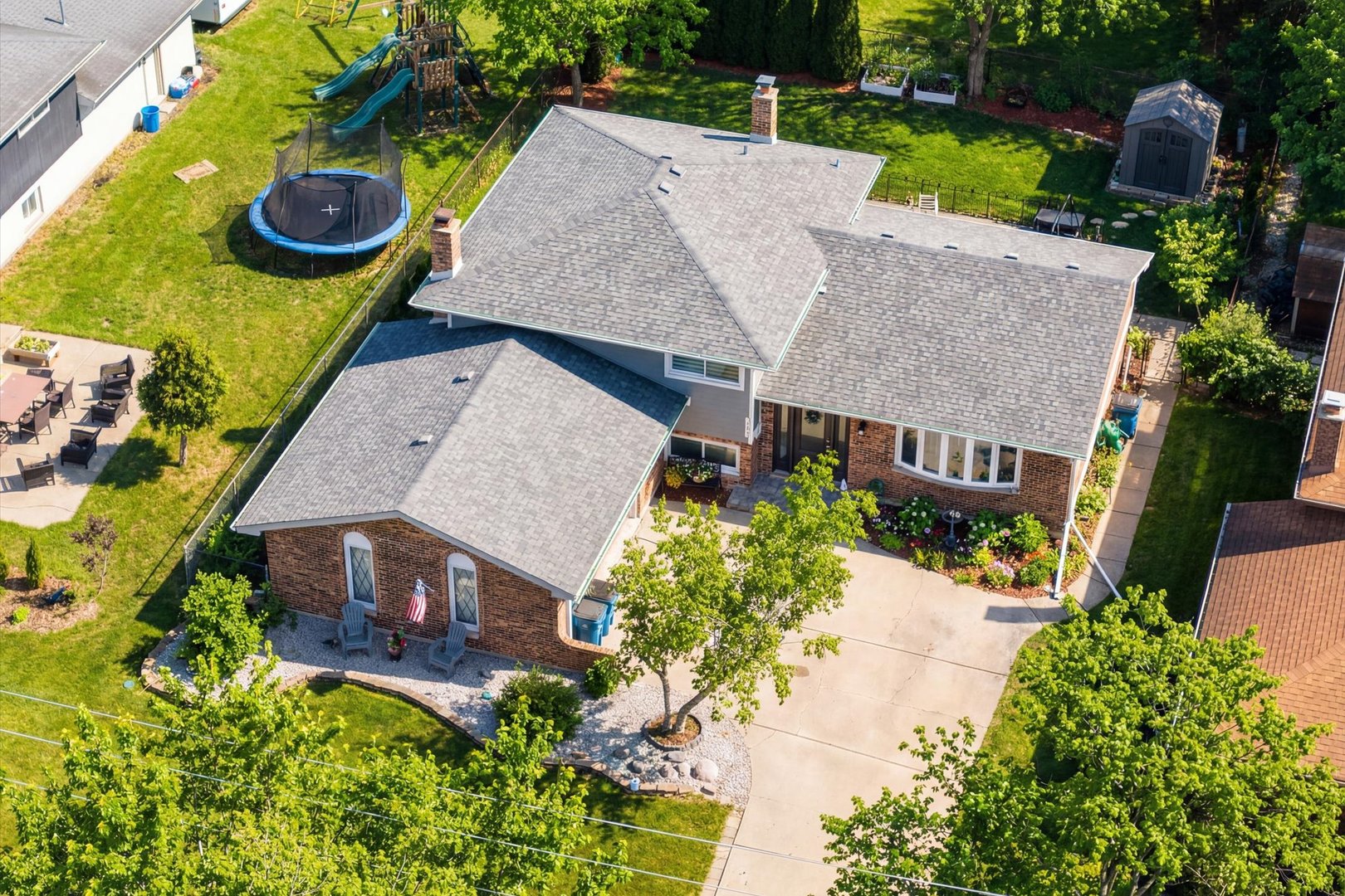 981 North Mill Road Addison, IL 60101 - Photo 40 of 41 an aerial view of a house with garden space and a patio