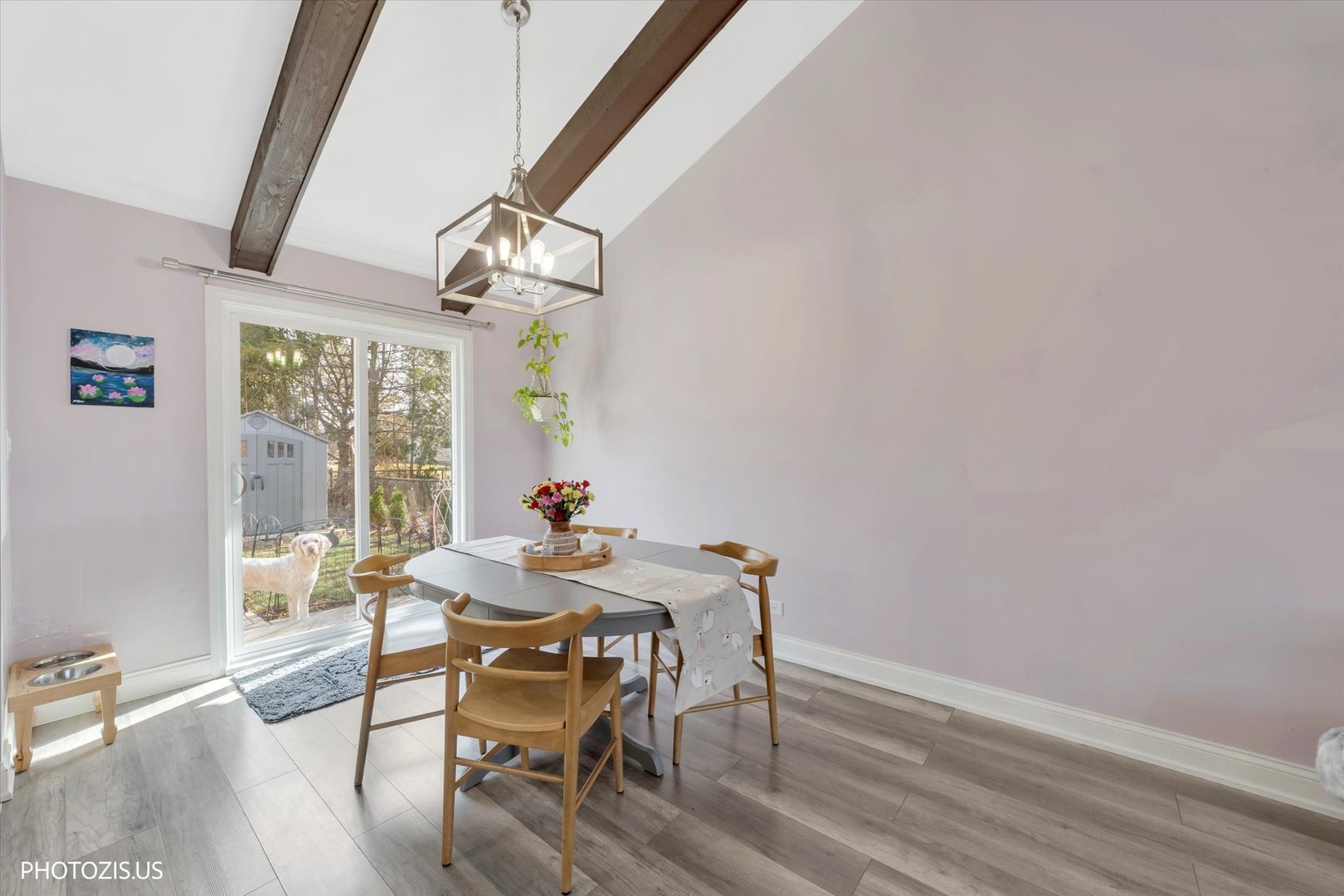 981 North Mill Road Addison, IL 60101 - Photo 8 of 41 a view of a dining room with furniture a chandelier and wooden floor