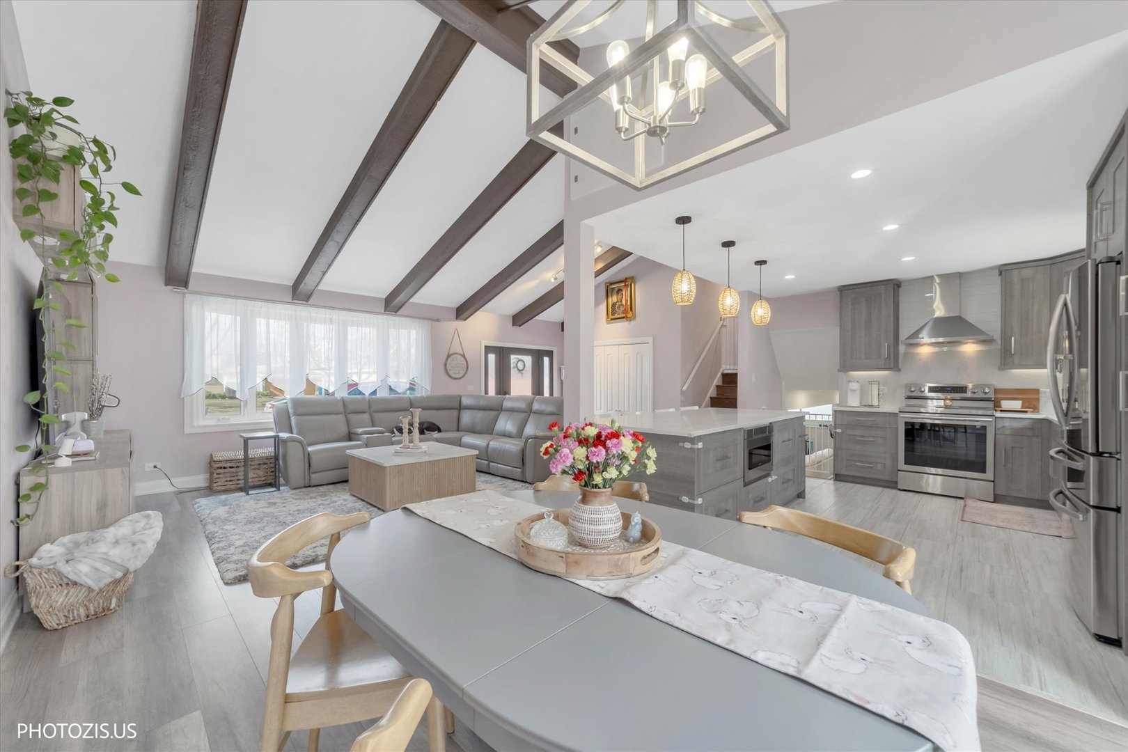 981 North Mill Road Addison, IL 60101 - Photo 9 of 41 a living room with lots of furniture and kitchen view