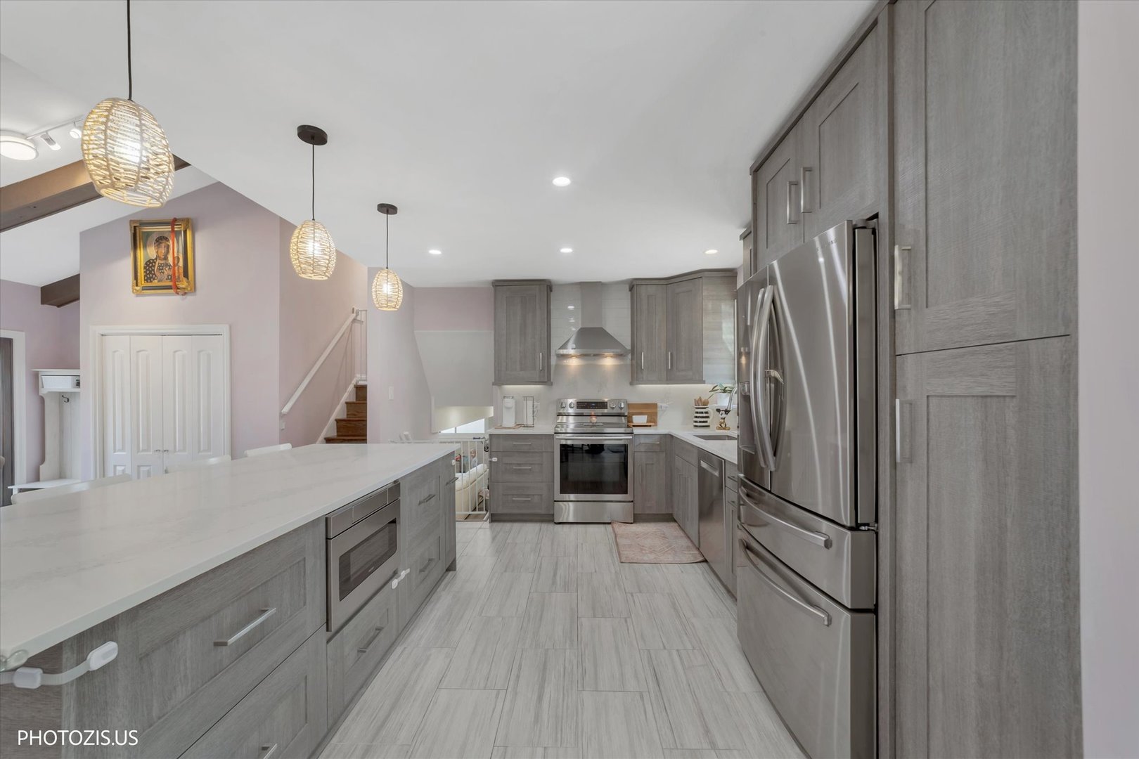 981 North Mill Road Addison, IL 60101 - Photo 10 of 41 a kitchen with a sink stainless steel appliances and cabinets