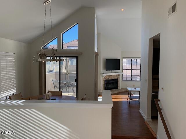 a living room with fireplace furniture and a flat screen tv