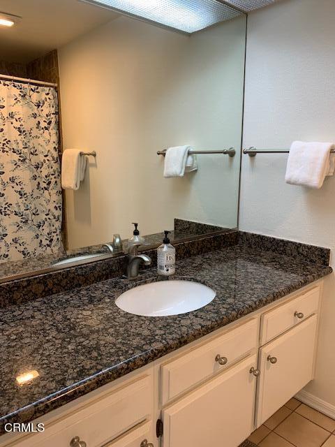407 Shoreview Drive Port Hueneme, CA 93041 - Photo 19 of 39 a bathroom with a granite countertop sink and a mirror