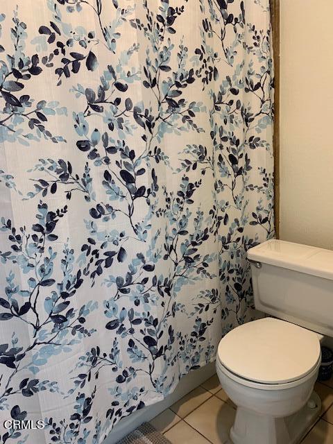 407 Shoreview Drive Port Hueneme, CA 93041 - Photo 20 of 39 a white toilet sitting next to a shower curtain