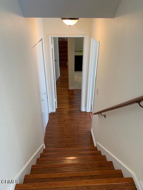 407 Shoreview Drive Port Hueneme, CA 93041 - Photo 21 of 39 a view of a hallway with wooden floor and staircase