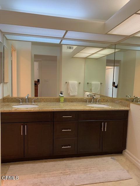 407 Shoreview Drive Port Hueneme, CA 93041 - Photo 26 of 39 a bathroom with a granite countertop sink and a mirror