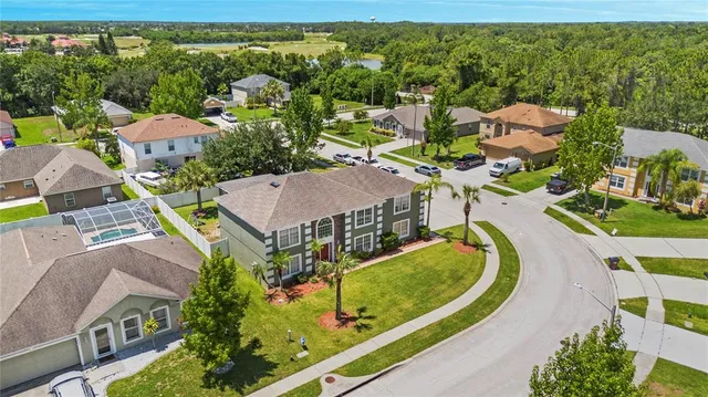 an aerial view of a house with a swimming pool