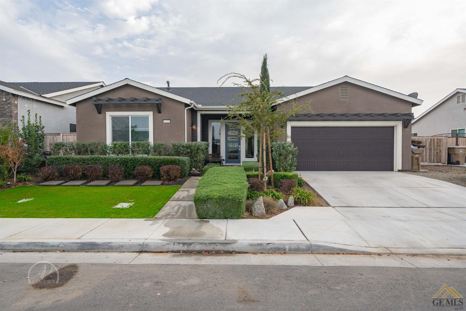 Undisclosed Address Shafter, CA 93263 - Photo 1 of 30 a front view of a house with a yard and garage