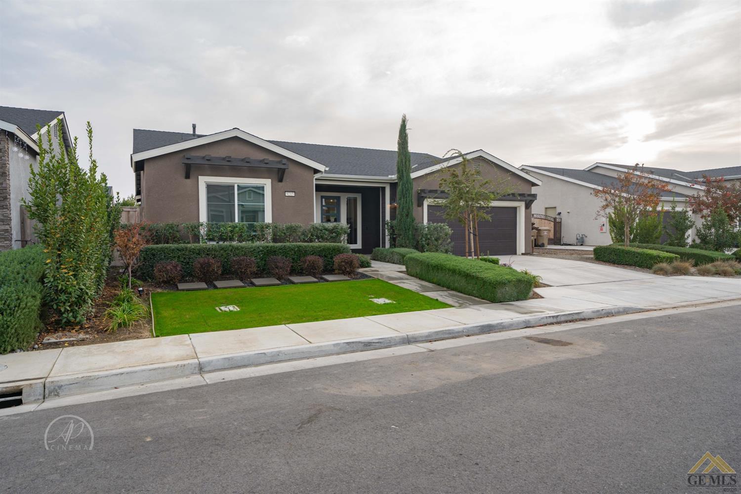 Undisclosed Address Shafter, CA 93263 - Photo 2 of 30 a front view of a house with a yard