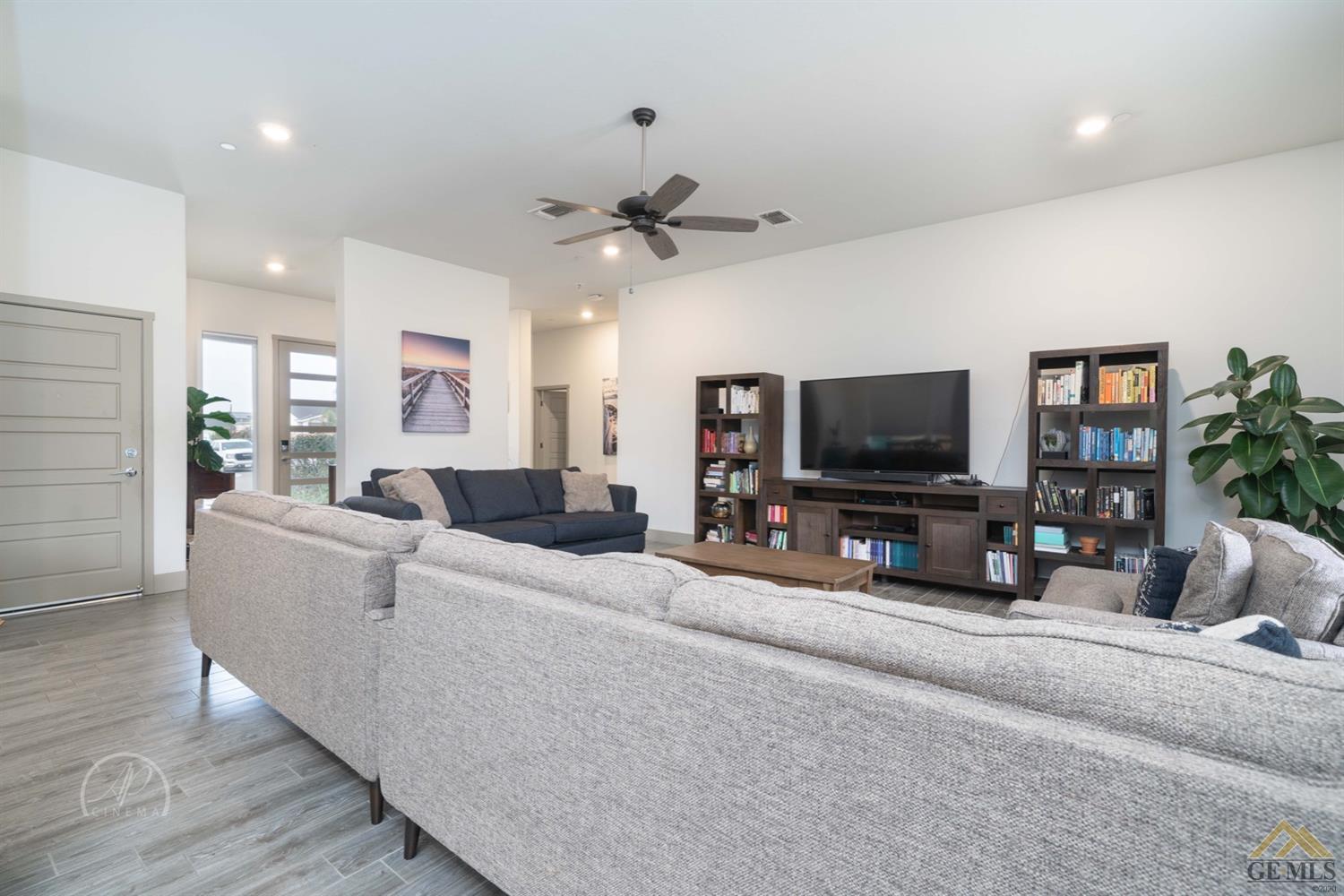 Undisclosed Address Shafter, CA 93263 - Photo 11 of 30 a living room with furniture and a flat screen tv