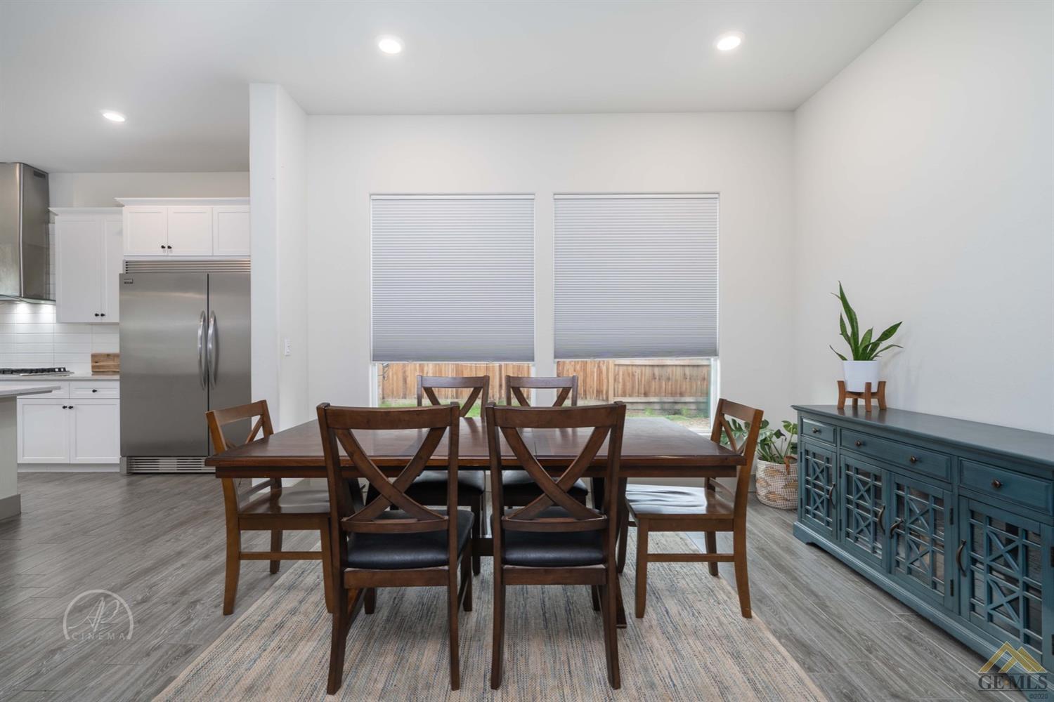 Undisclosed Address Shafter, CA 93263 - Photo 13 of 30 a view of a dining room with furniture and wooden floor