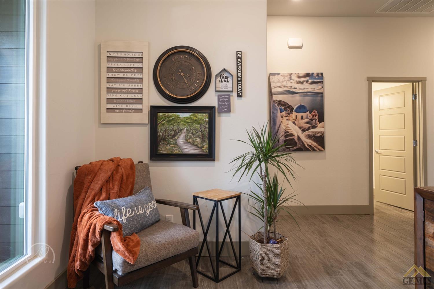 Undisclosed Address Shafter, CA 93263 - Photo 16 of 30 a living room with furniture and a potted plant