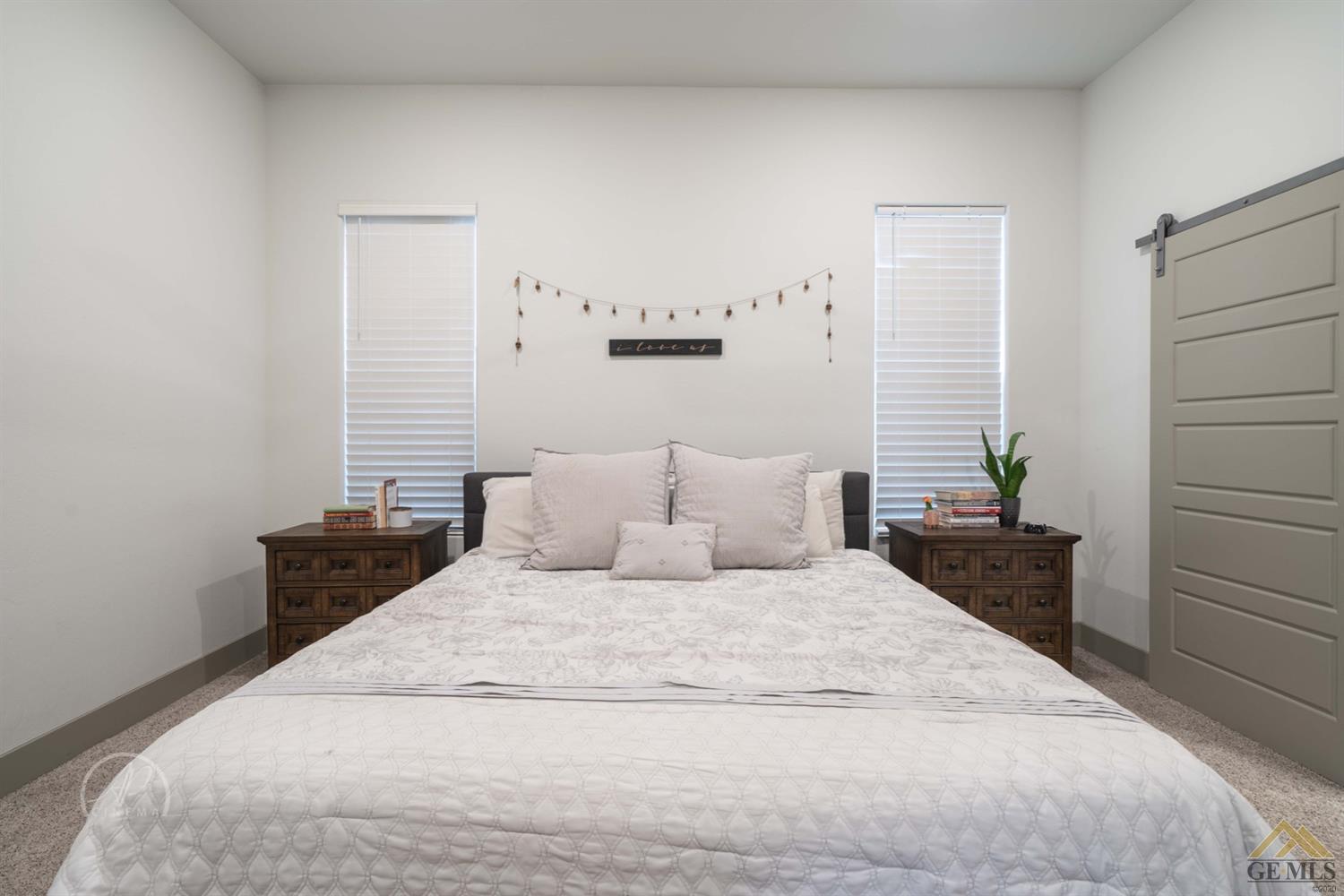 Undisclosed Address Shafter, CA 93263 - Photo 18 of 30 a large bed sitting in a bedroom next to a window