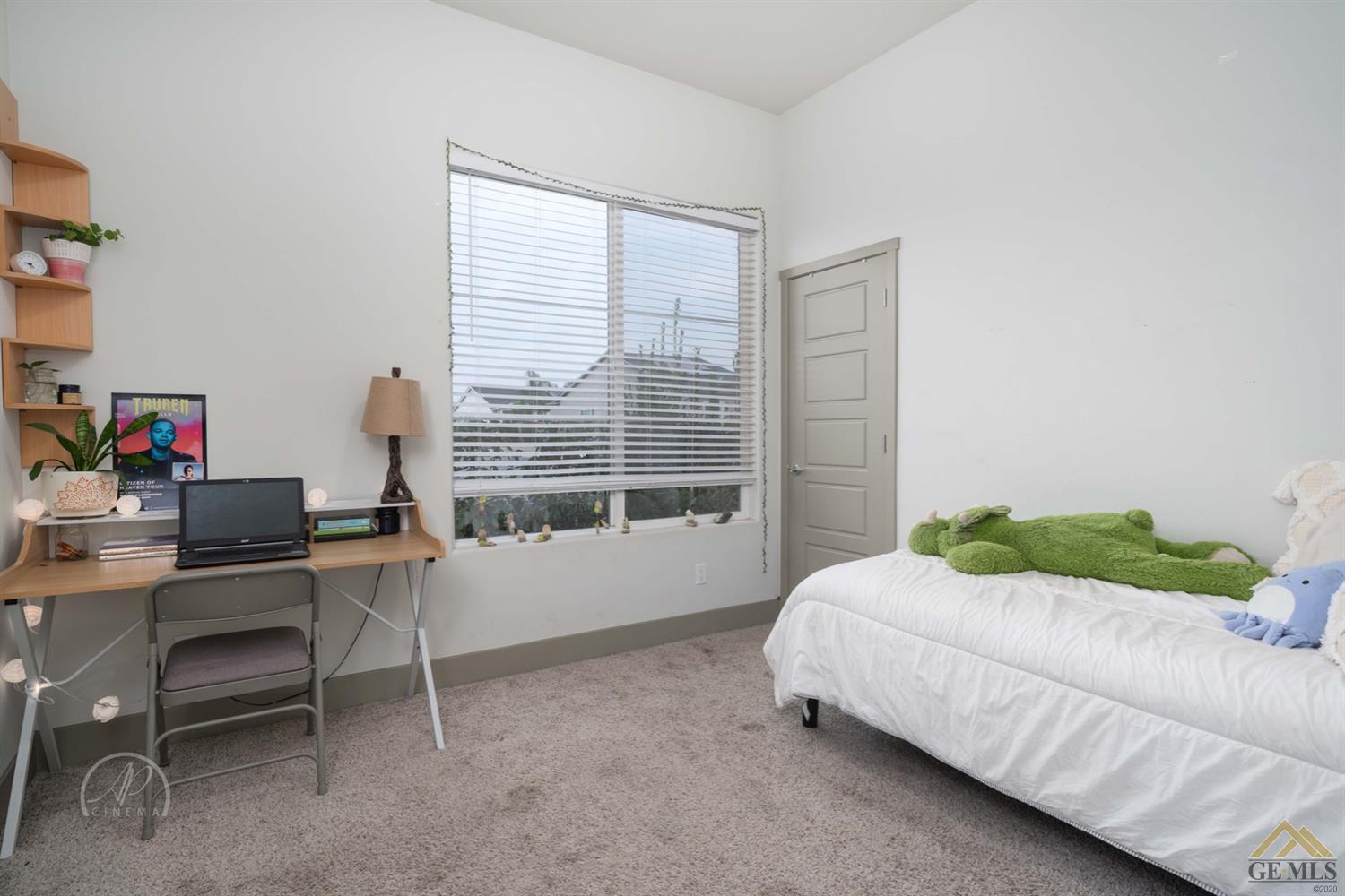 Undisclosed Address Shafter, CA 93263 - Photo 26 of 30 a bedroom with a bed and a desk