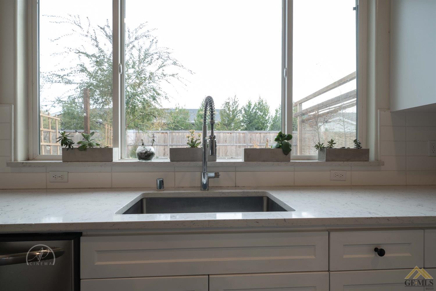 Undisclosed Address Shafter, CA 93263 - Photo 8 of 30 a kitchen counter top with a sink and dishwasher