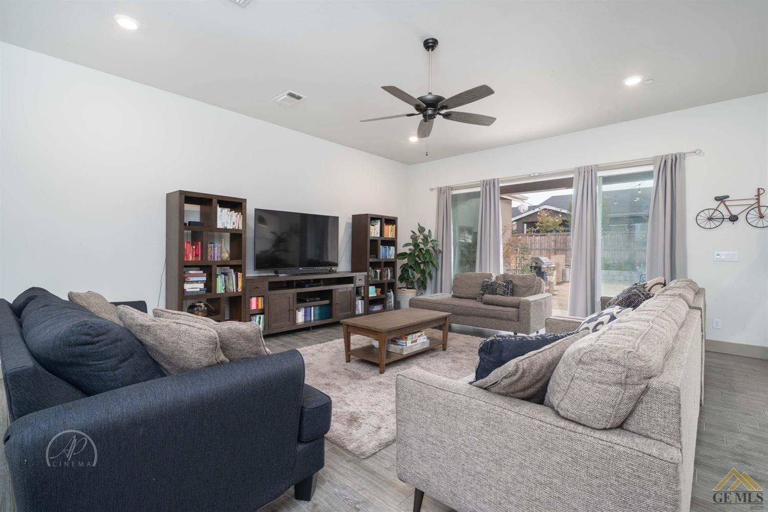 Undisclosed Address Shafter, CA 93263 - Photo 10 of 30 a living room with furniture and a flat screen tv