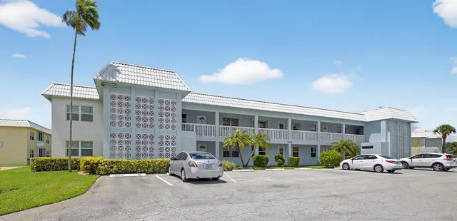 a front view of a house with a patio