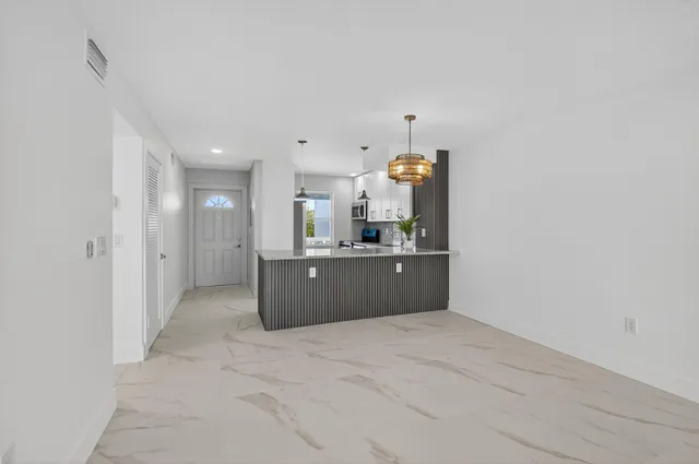 a view of a room with a large window