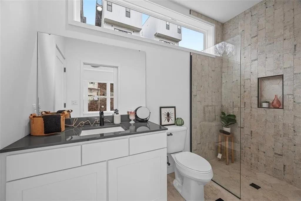 431 Shaler Street Pittsburgh, PA 15211 - Photo 15 of 33 a bathroom with a granite countertop sink toilet and shower