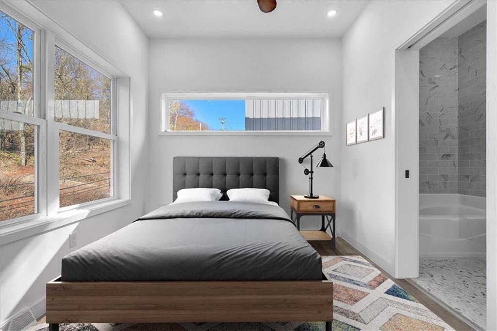 431 Shaler Street Pittsburgh, PA 15211 - Photo 18 of 33 a bedroom with a large bed and a window