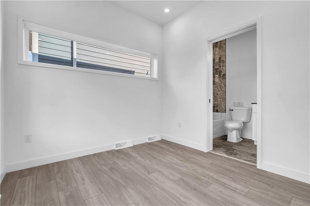 431 Shaler Street Pittsburgh, PA 15211 - Photo 21 of 33 a view of a room with wooden floor and bathroom view