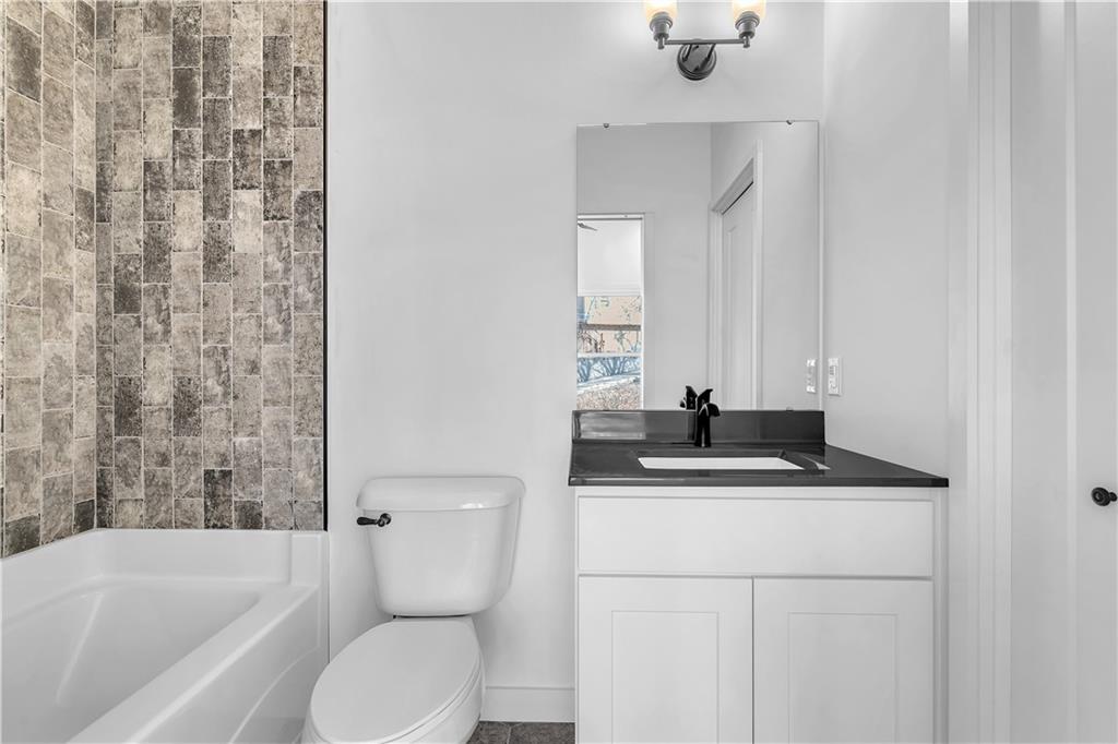 431 Shaler Street Pittsburgh, PA 15211 - Photo 22 of 33 a bathroom with a sink a toilet and bathtub