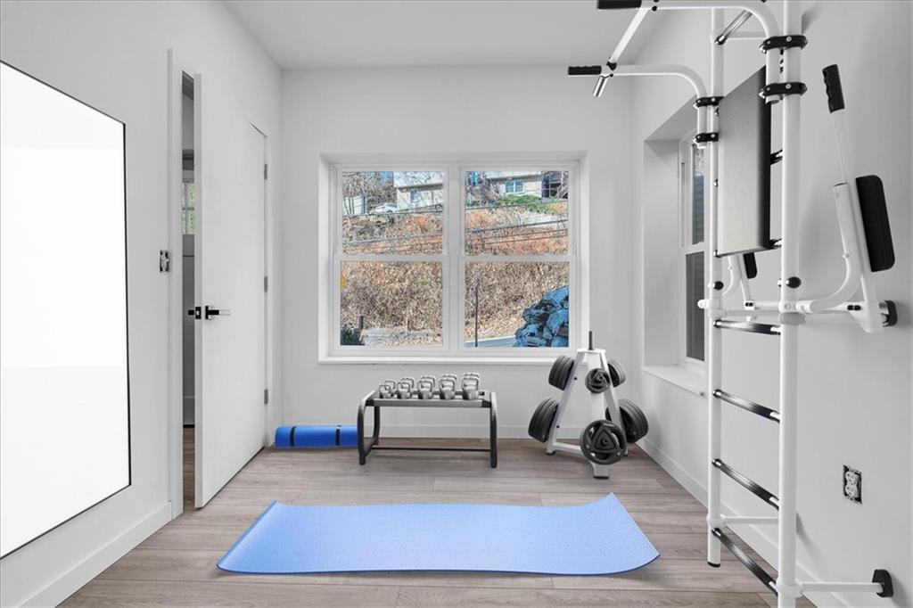 431 Shaler Street Pittsburgh, PA 15211 - Photo 26 of 33 a living room with furniture a rug and a floor to ceiling window