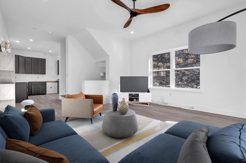 431 Shaler Street Pittsburgh, PA 15211 - Photo 4 of 33 a living room with furniture a ceiling fan and a window