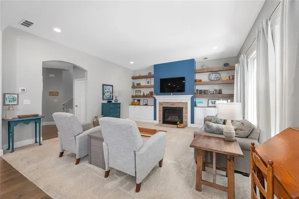 a living room with furniture and a large window