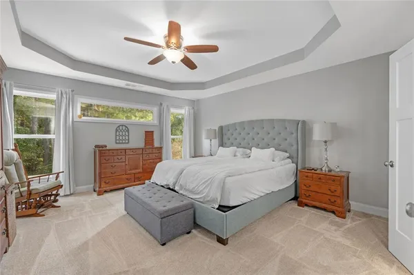 a bedroom with a large bed and a window