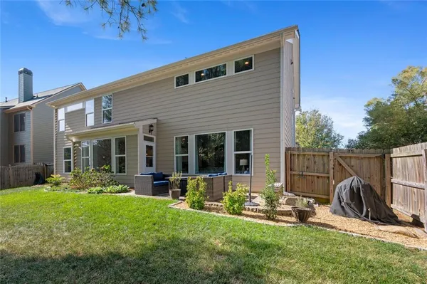 a view of a house with backyard porch and patio
