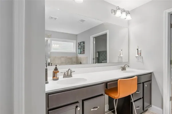 a living room with furniture a rug and a window