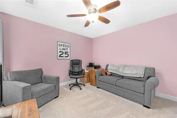 a bathroom with a sink a toilet and shower curtain