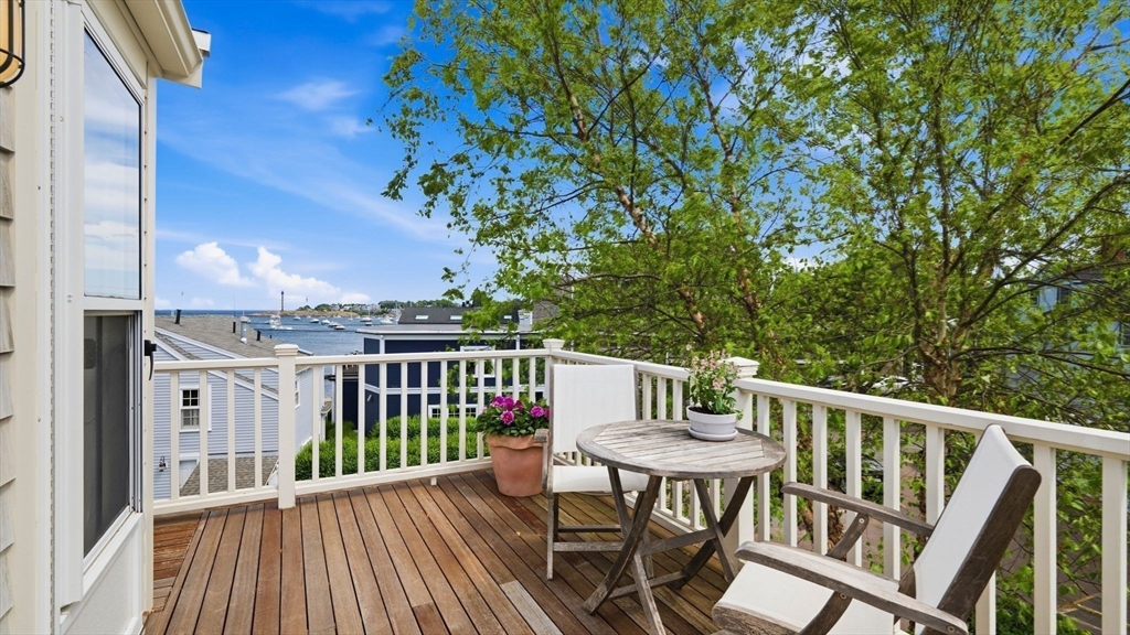33 Franklin Street Marblehead, MA 01945 - Photo 3 of 42 a view of a deck with furniture