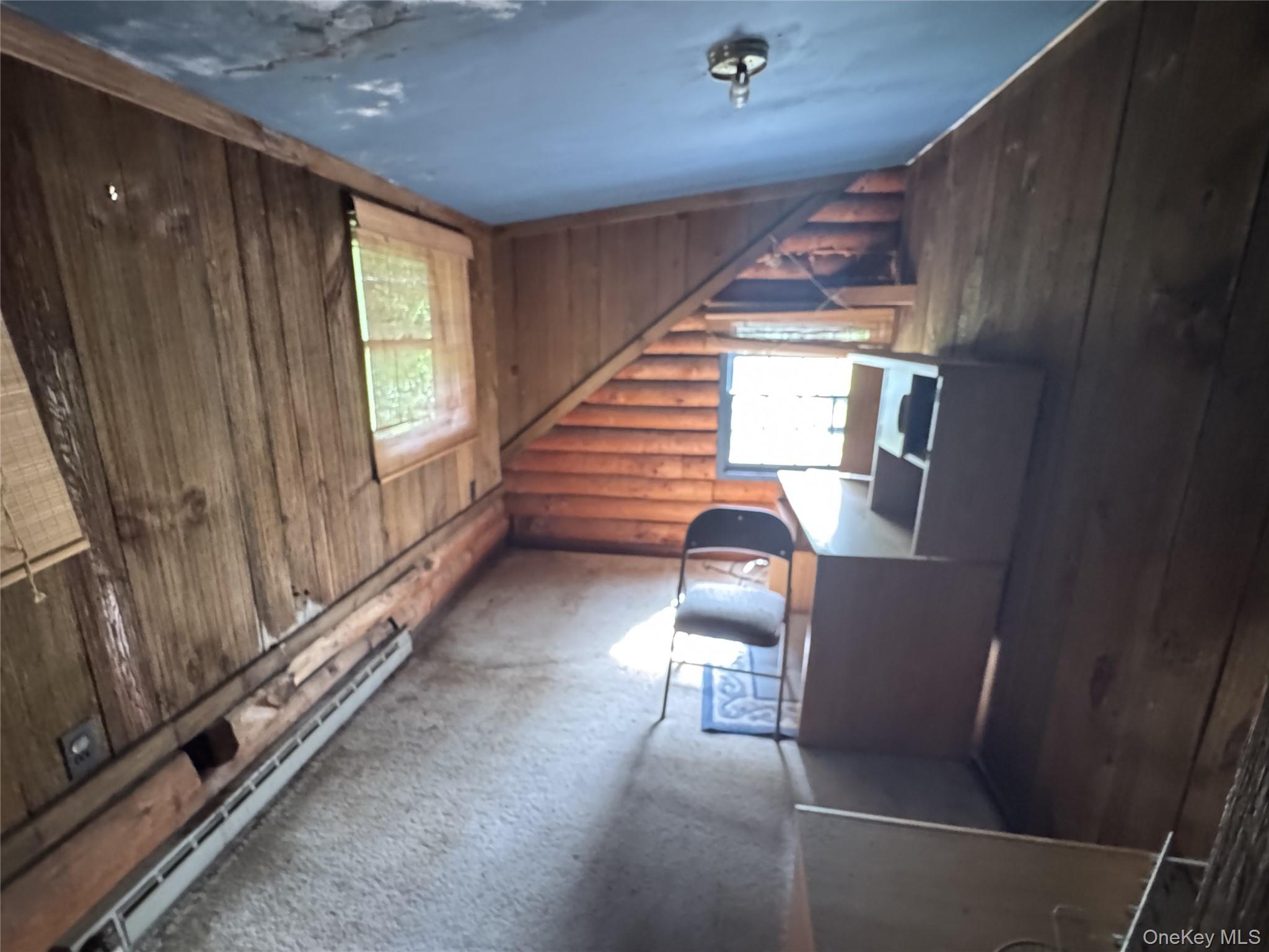 68 Union School Road Montgomery, NY 12549 - Photo 16 of 37 Unfurnished office with a baseboard heating unit, rustic walls, wooden walls, and carpet