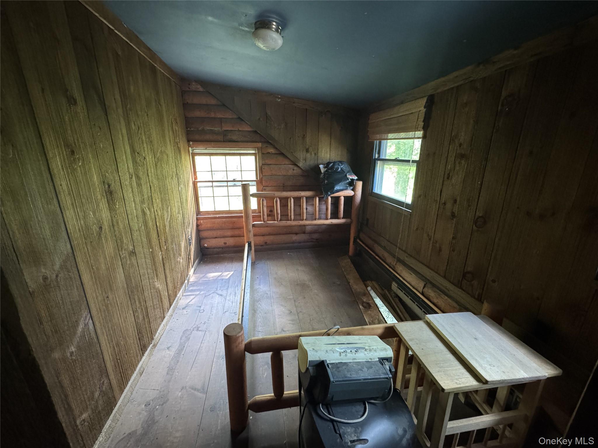 68 Union School Road Montgomery, NY 12549 - Photo 17 of 37 Miscellaneous room featuring hardwood / wood-style floors and wooden walls