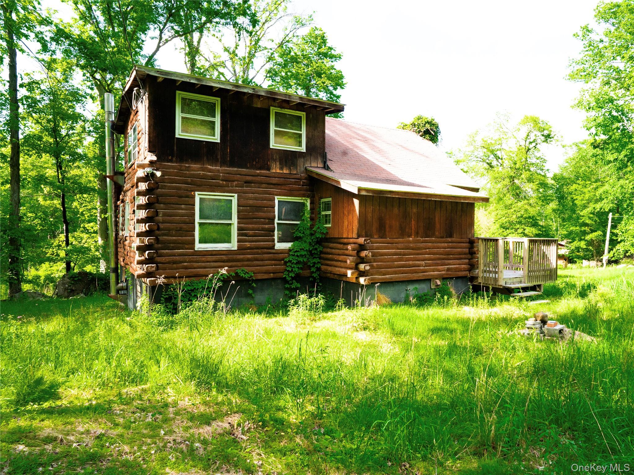 68 Union School Road Montgomery, NY 12549 - Photo 4 of 37 Back of property featuring log exterior and a wooden deck