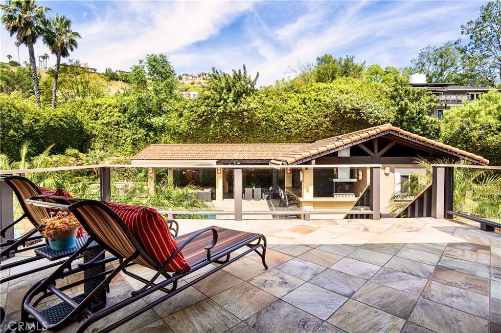 19151 Fowler Avenue Santa Ana, CA 92705 - Photo 13 of 57 View from the Master Bedroom deck to the backyard pool oasis.