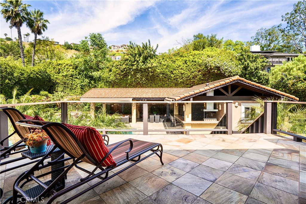 19151 Fowler Avenue Santa Ana, CA 92705 - Photo 13 of 57 View from the Master Bedroom deck to the backyard pool oasis.