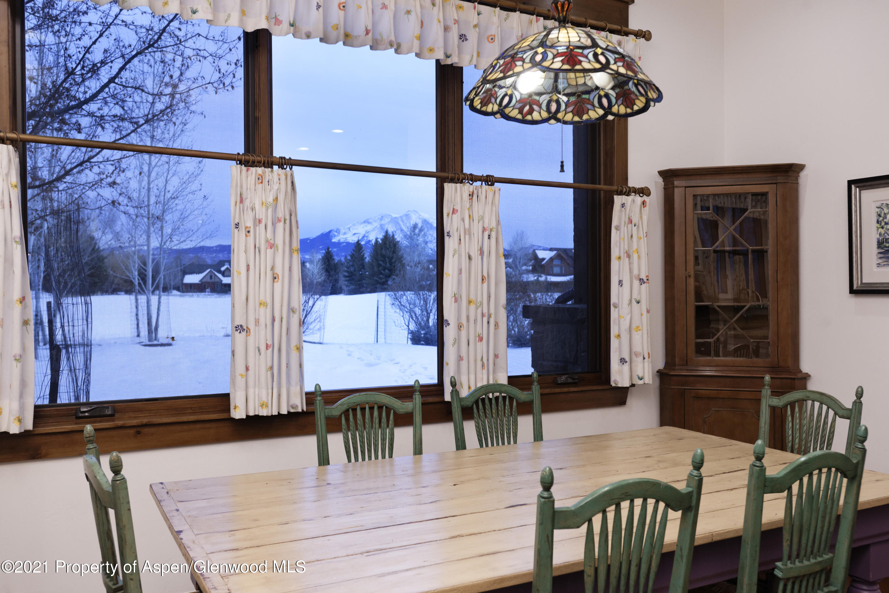 132 Diamond A Ranch Road Carbondale, CO 81623 - Photo 27 of 50 a view of a dining room with furniture and chandelier