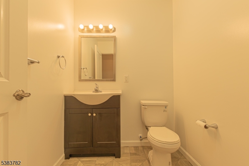 246 James Street Hackensack, NJ 07601 - Photo 4 of 23 a bathroom with a sink a toilet and shower