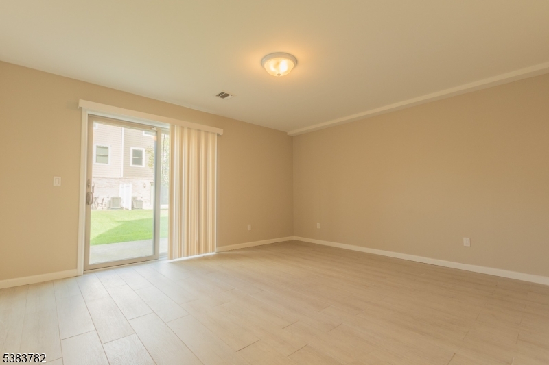 246 James Street Hackensack, NJ 07601 - Photo 6 of 23 an empty room with an entryway and empty room