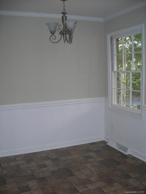 4701 Fairheath Road, Unit 23 Charlotte, NC 28210 - Photo 4 of 5 a view of an empty room with a window