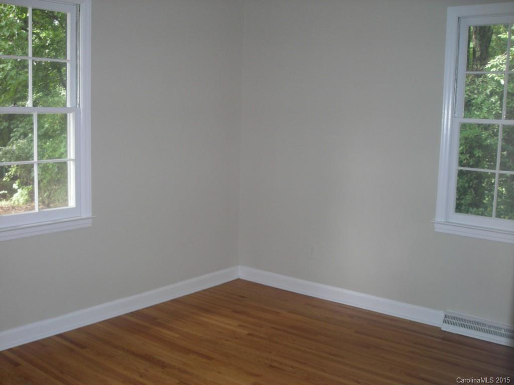4701 Fairheath Road, Unit 23 Charlotte, NC 28210 - Photo 5 of 5 a view of a small space with wooden floor and windows