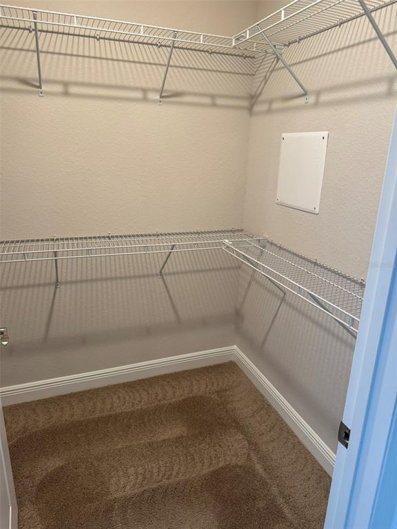 2460 Ann Rou Road, Unit 606 Tavares, FL 32778 - Photo 14 of 18 a view of a room with racks on the wall