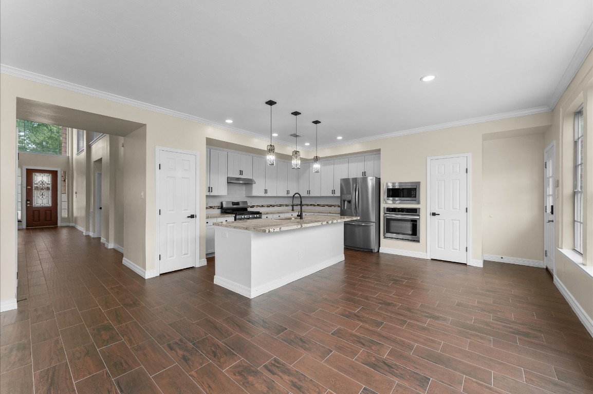 6330 Borg Breakpoint Drive Spring, TX 77379 - Photo 12 of 49 a view of kitchen with wooden floor