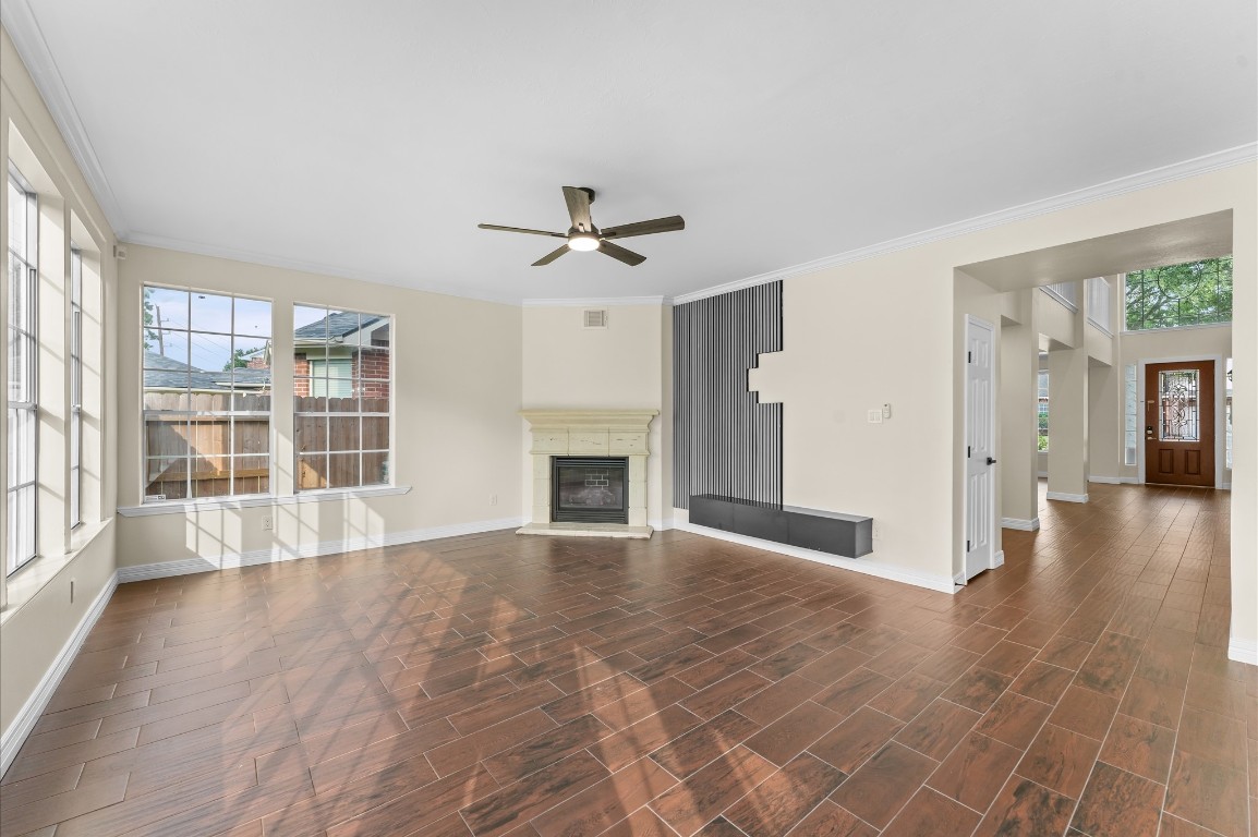 6330 Borg Breakpoint Drive Spring, TX 77379 - Photo 16 of 49 a view of an empty room with a fireplace and a window