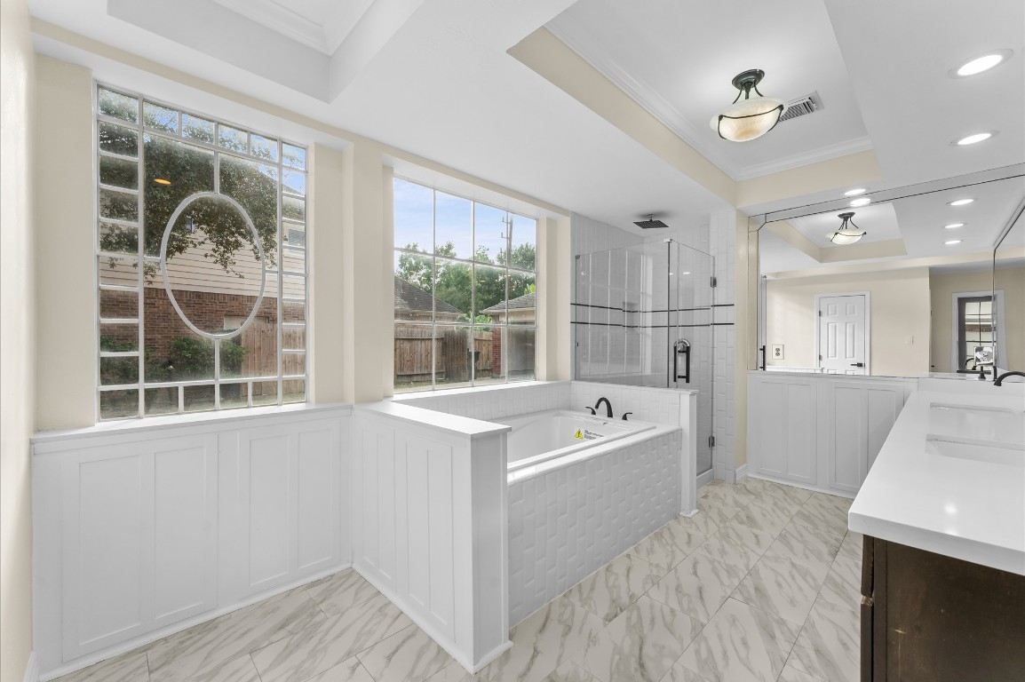 6330 Borg Breakpoint Drive Spring, TX 77379 - Photo 20 of 49 a bathroom with a tub a sink and a large window